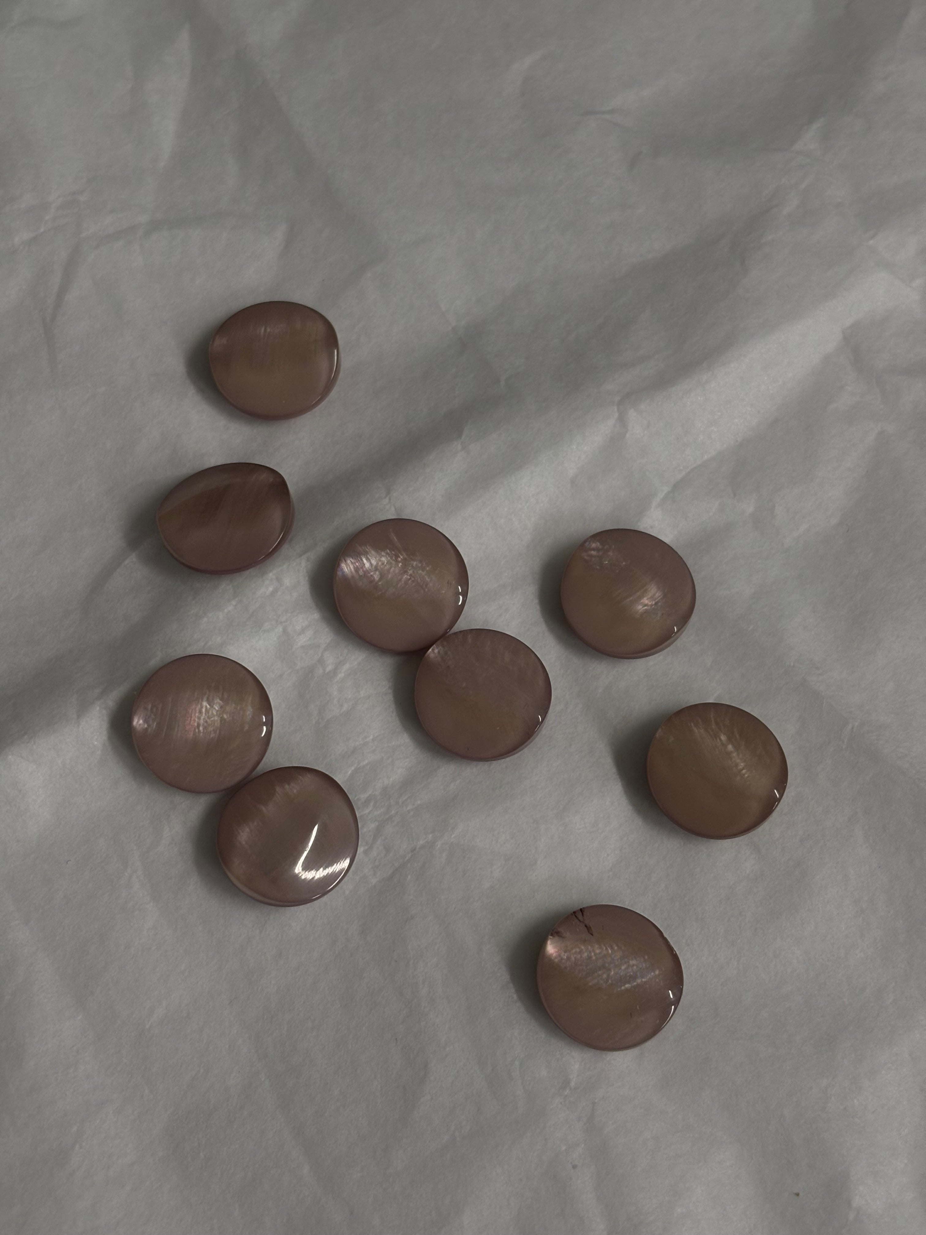 Plasthnappar bleikir